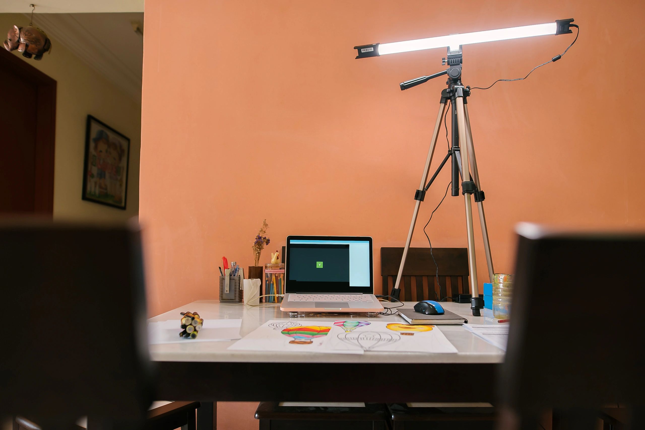Creative desk setup with laptop and design tools