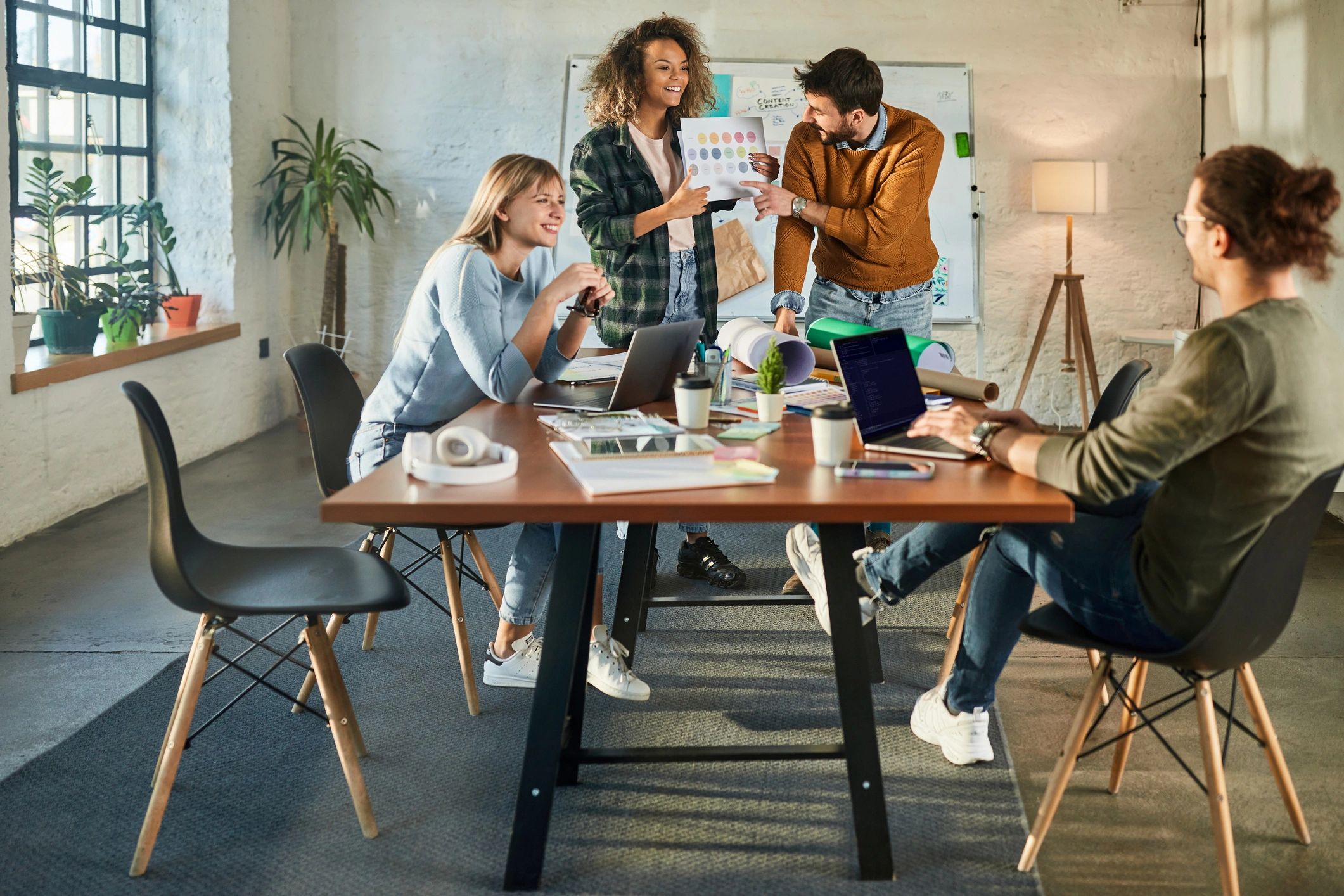 Creative design team collaborating in a casual studio